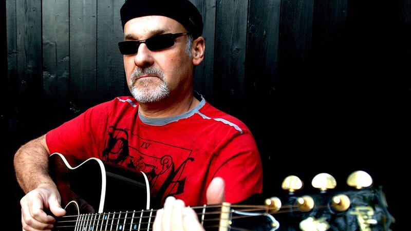 Man Playing Guitar — Red, Serious