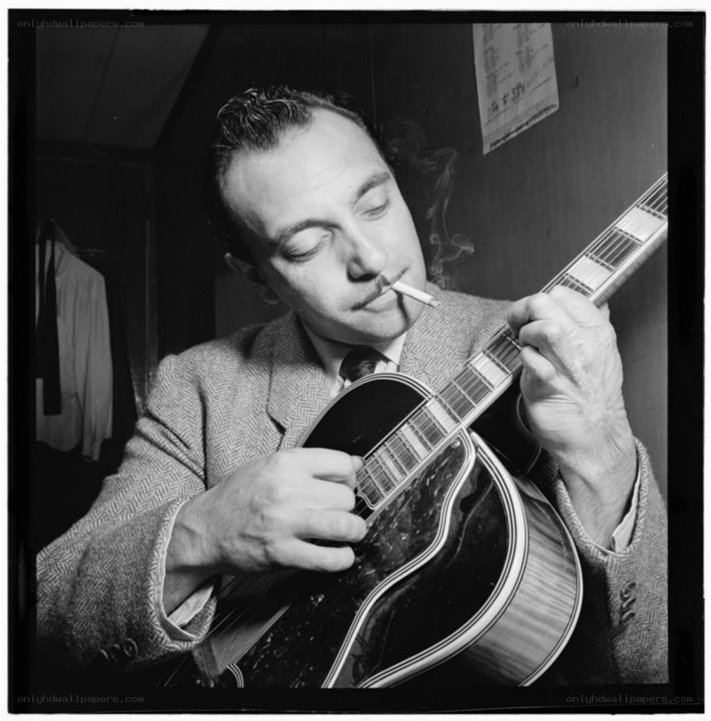 Man playing guitar with cigarette