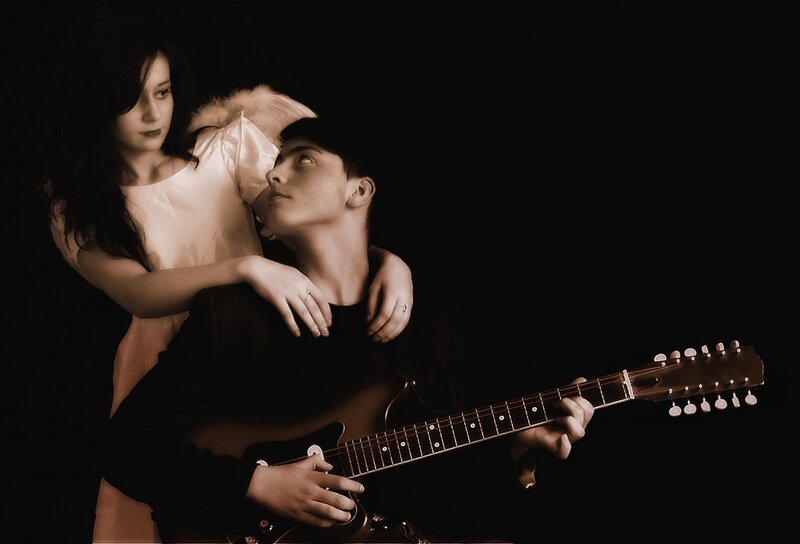 Man Playing Guitar with Woman — Black, Dramatic