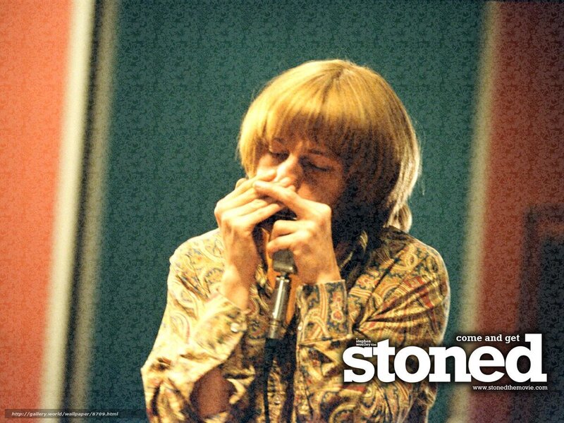 man playing harmonica