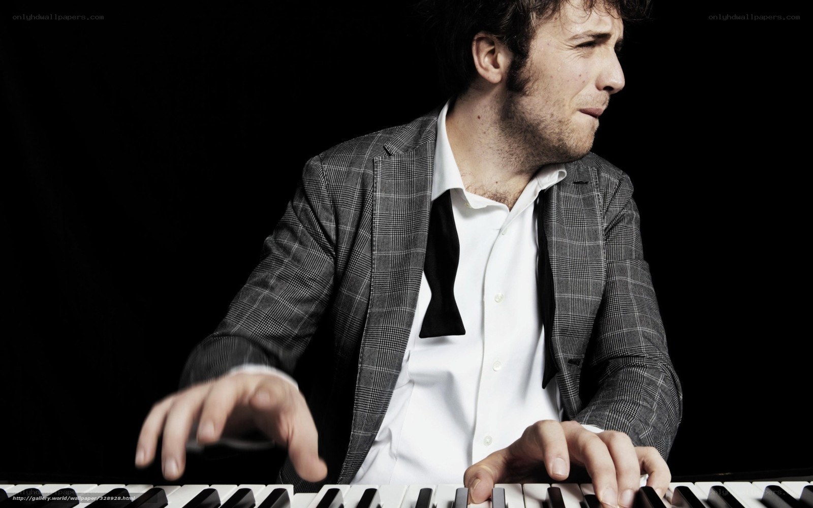 man playing keyboard piano