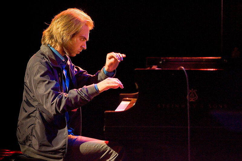 Man Playing Piano — Black, Focused