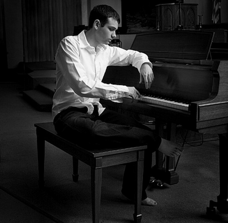 Man Playing Piano — Black, Serious