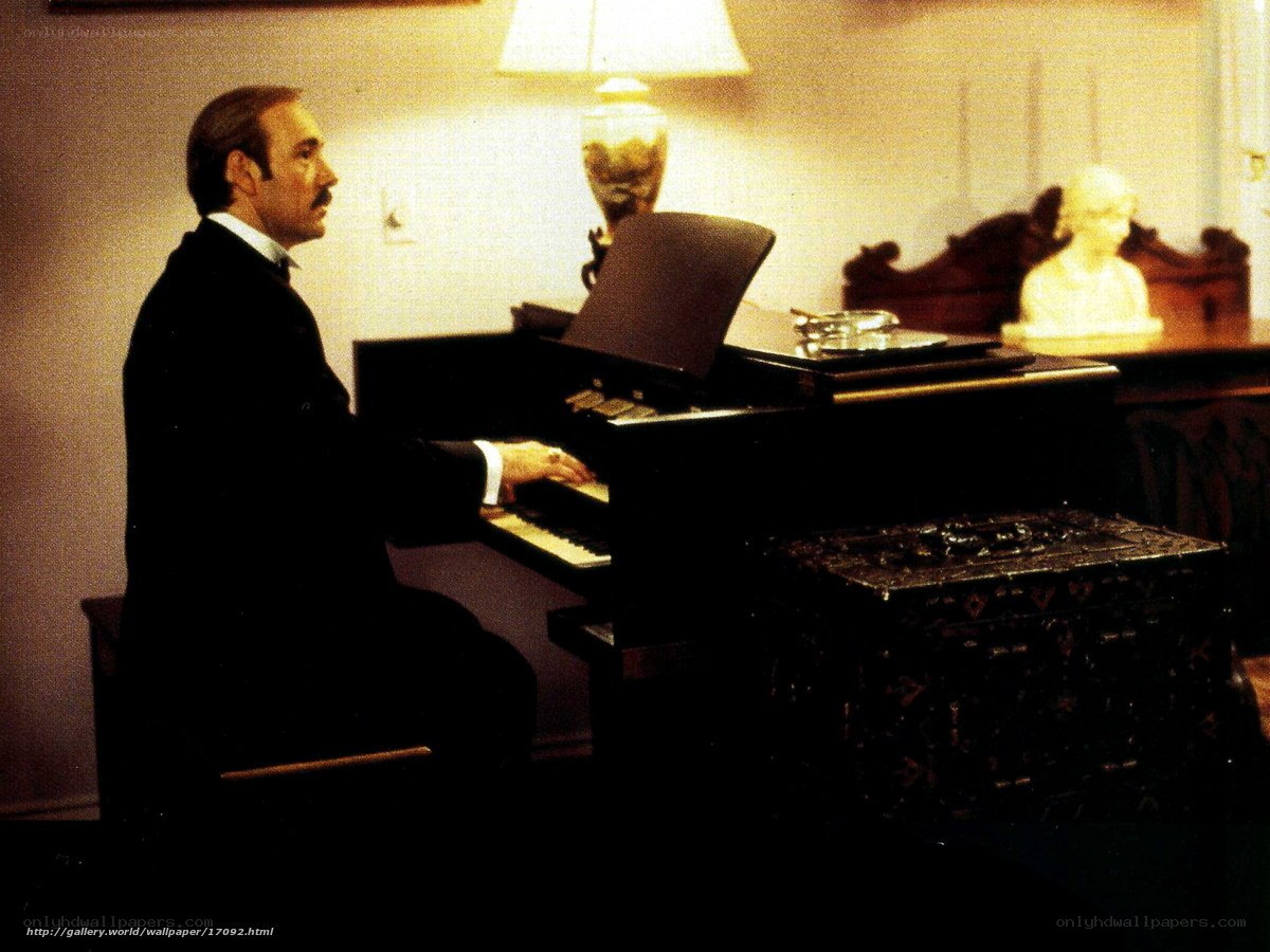 man playing piano in room