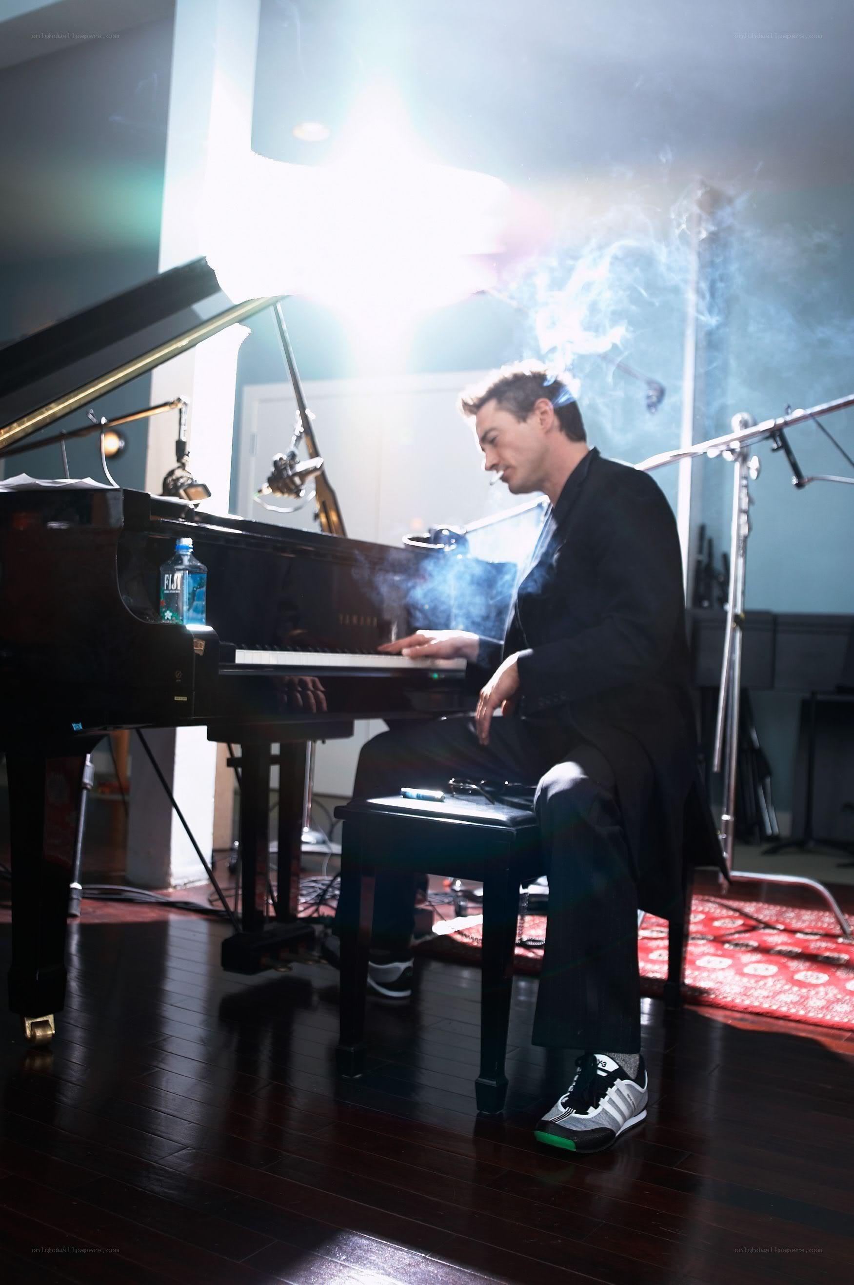 Man playing piano in studio