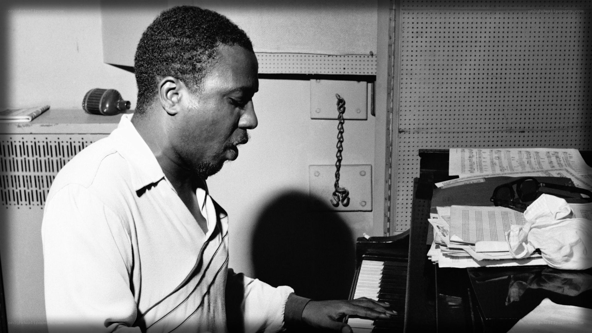 man playing piano in studio