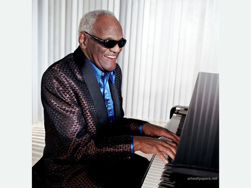 man playing piano in suit