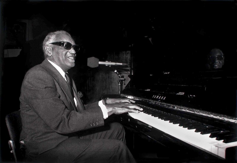 Man playing piano in suit