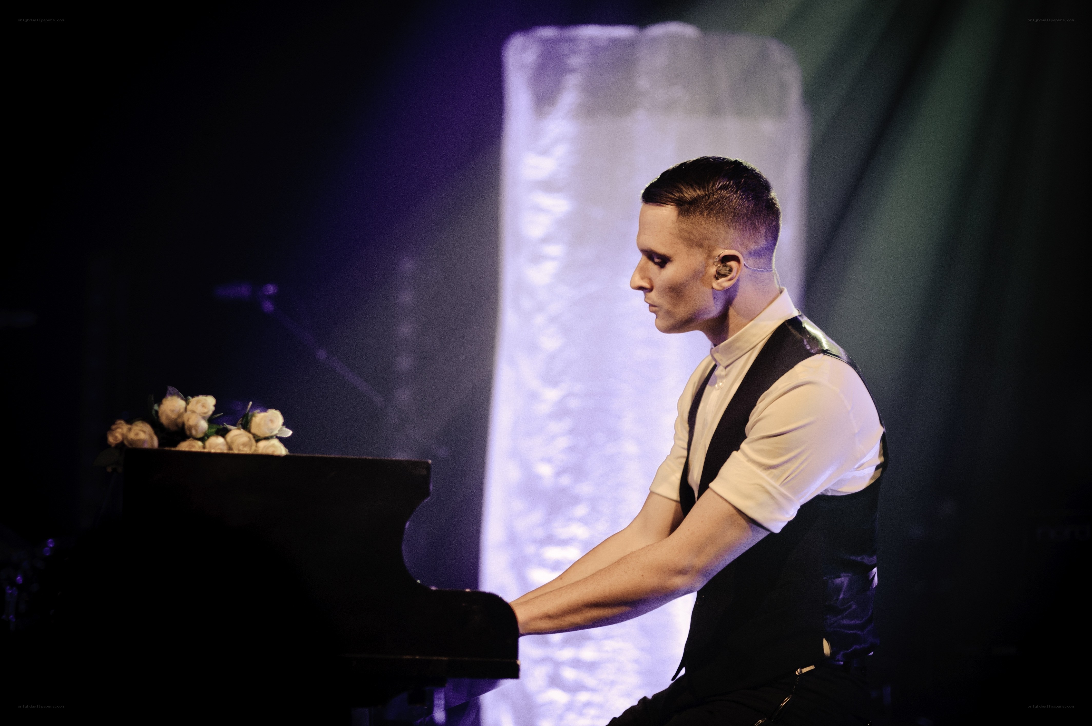 Man playing piano on stage