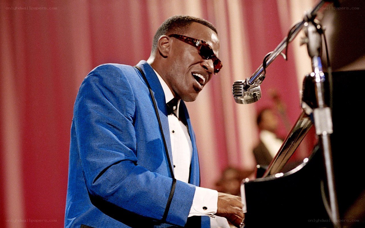 man playing piano on stage