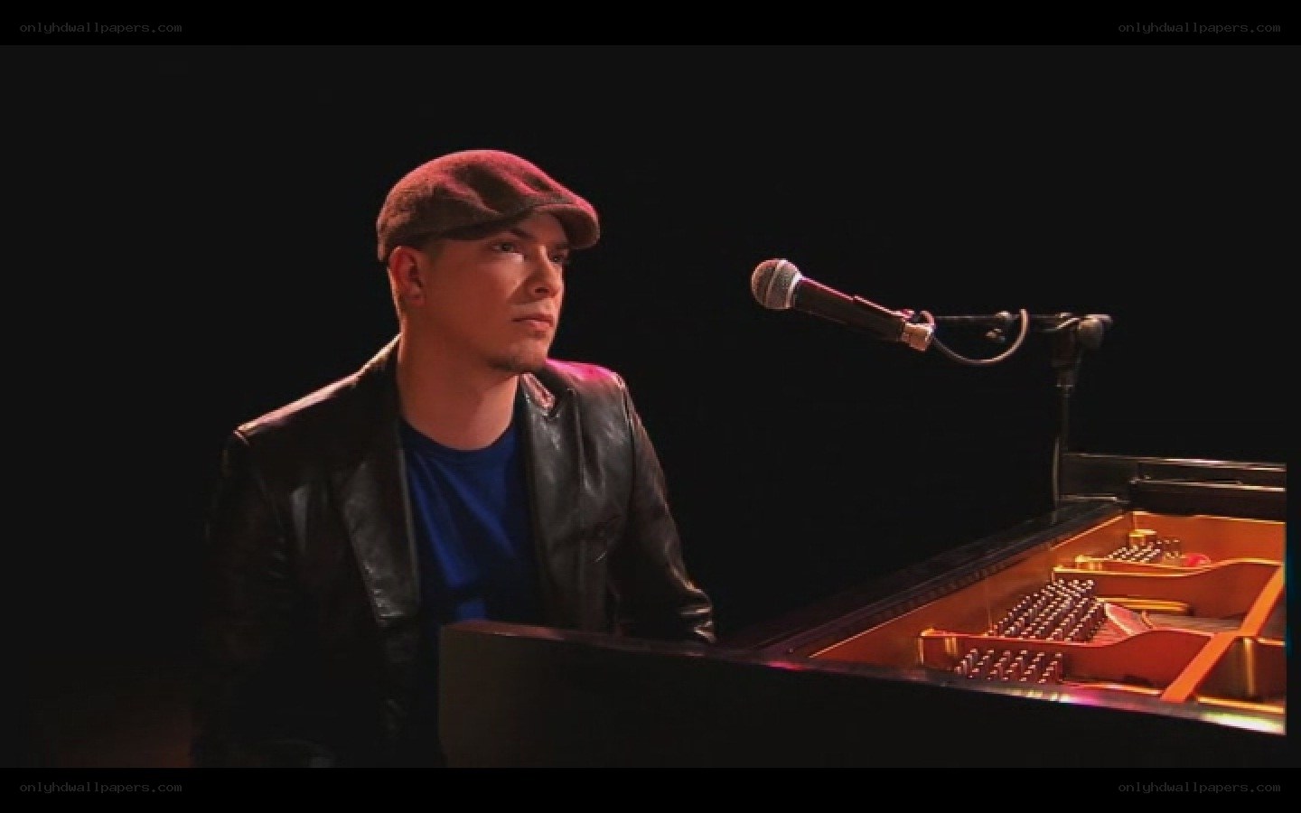 man playing piano on stage