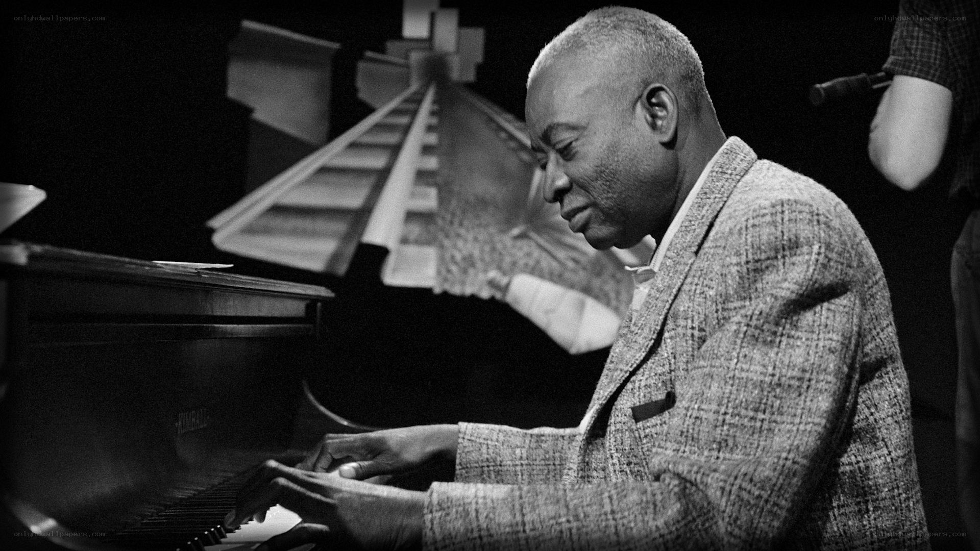 man playing piano on stage
