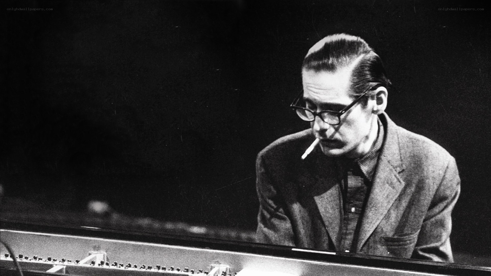 man playing piano with cigarette