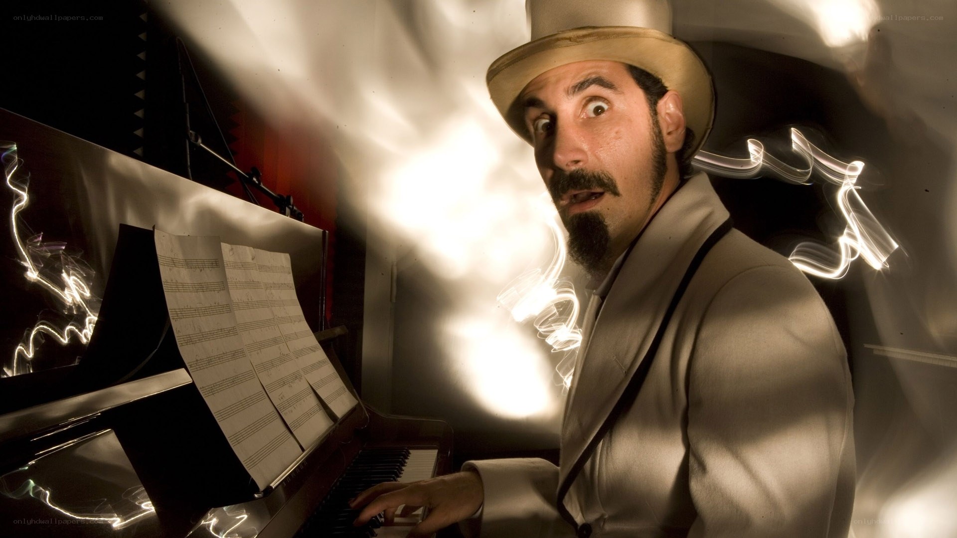 man playing piano with light trails