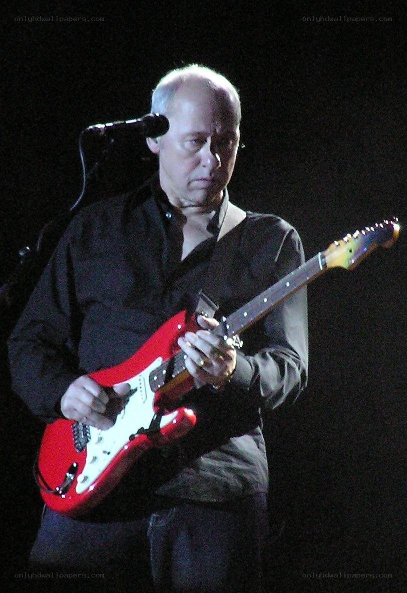 Man playing red electric guitar