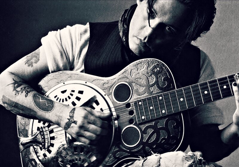 Man Playing Resonator Guitar