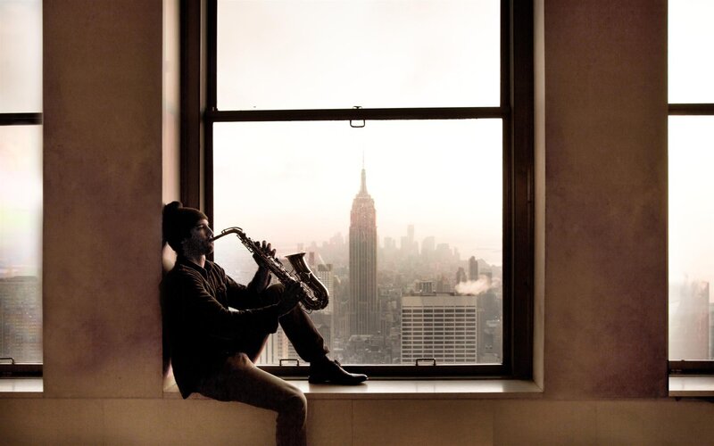 Man Playing Saxophone — Brown, Contemplative
