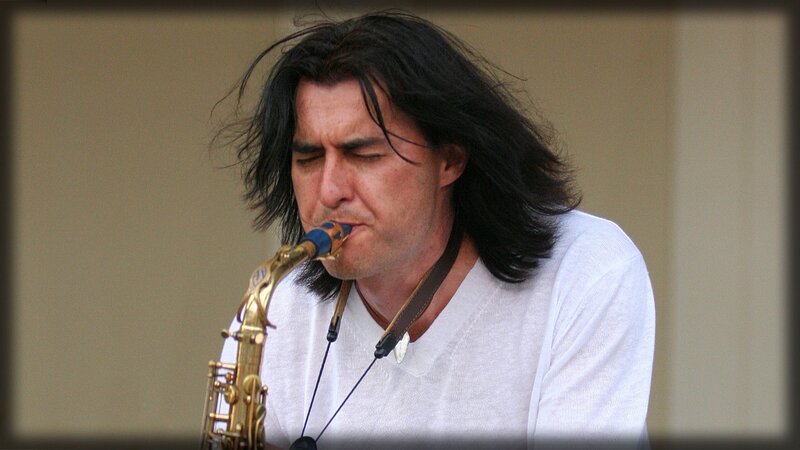 Man Playing Saxophone — White, Focused