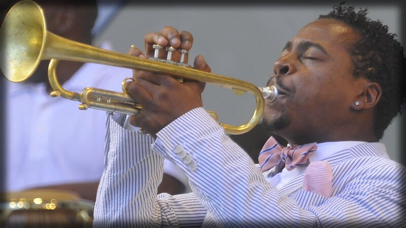 man playing trumpet at concert