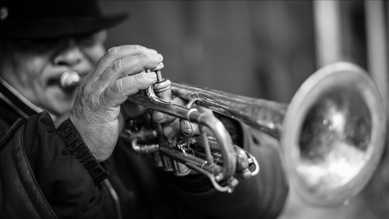Man Playing Trumpet — Black, Dramatic, Photograph, Hat, Coat