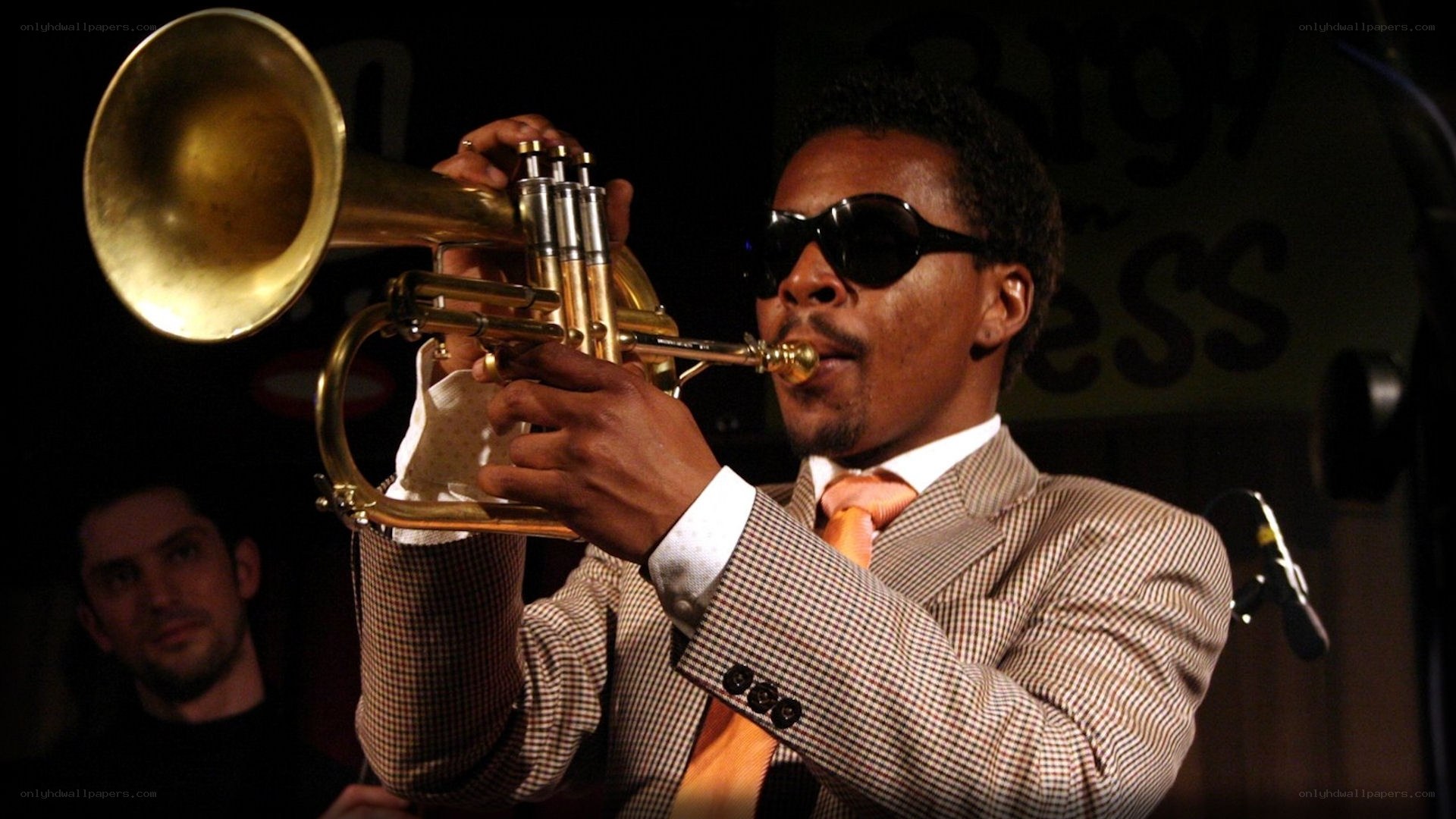 Man playing trumpet on stage