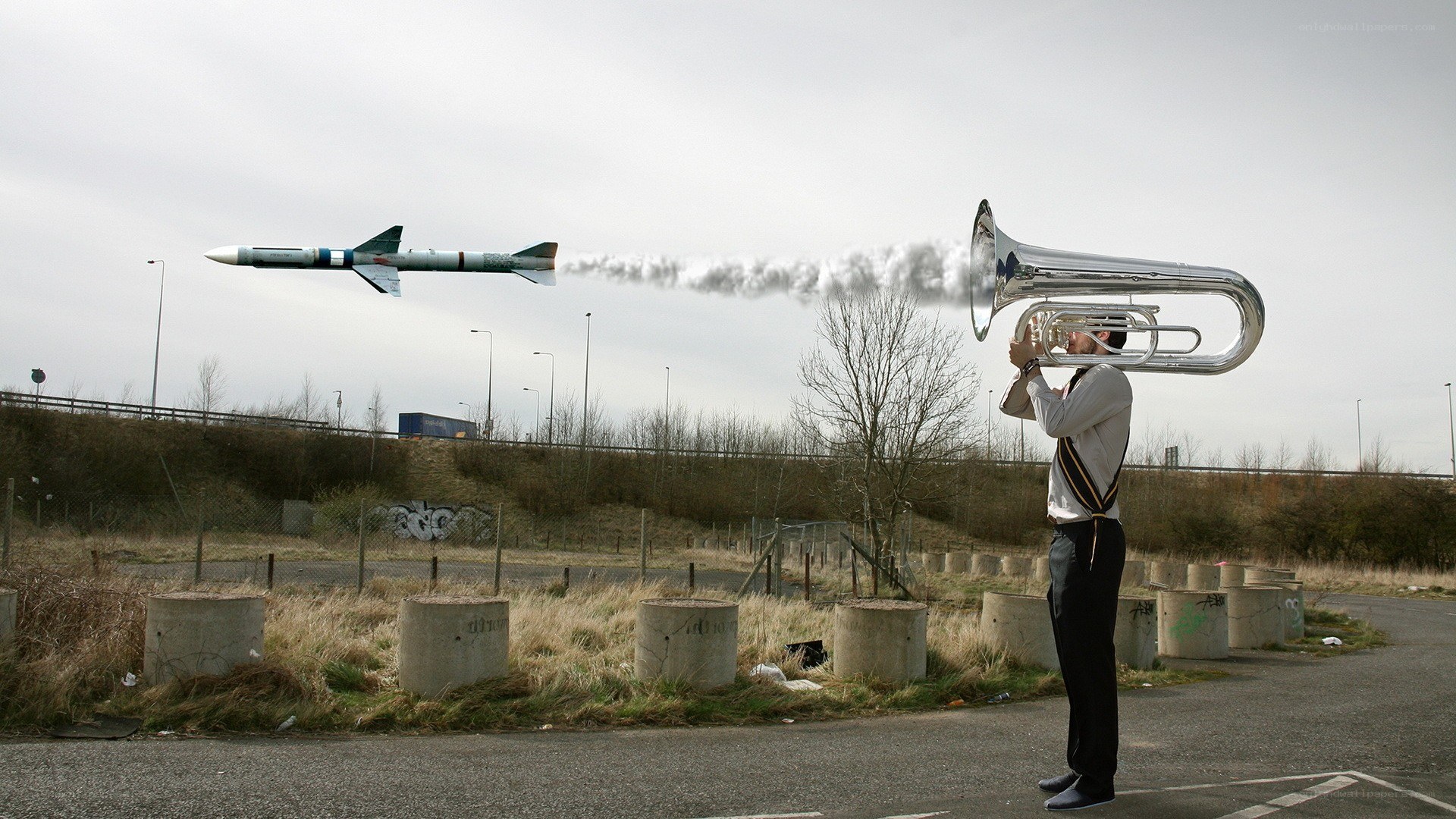 Man playing tuba with missile