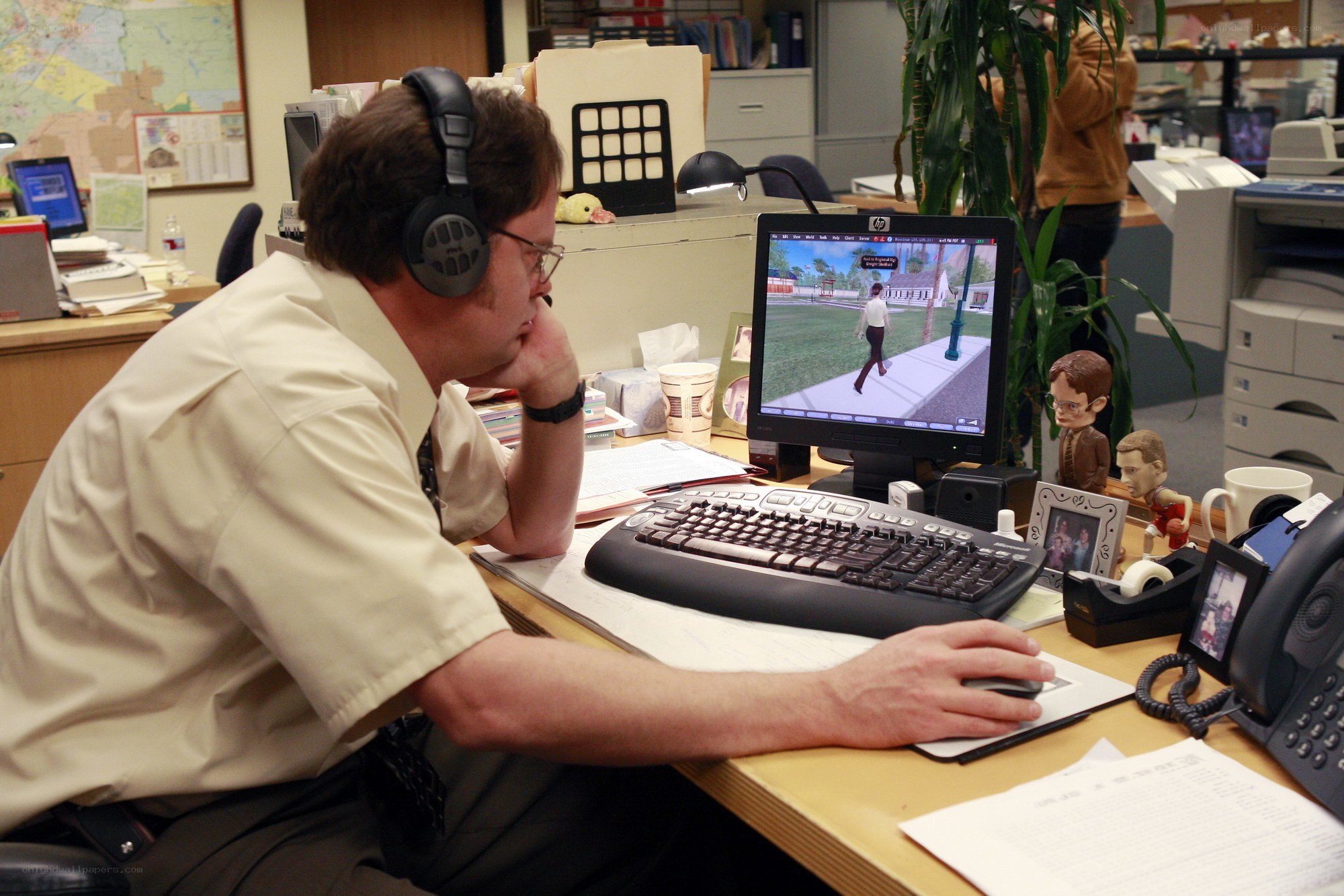 man playing video game at desk