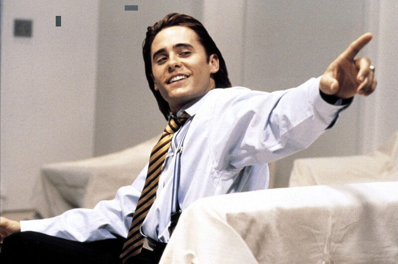 man pointing and smiling