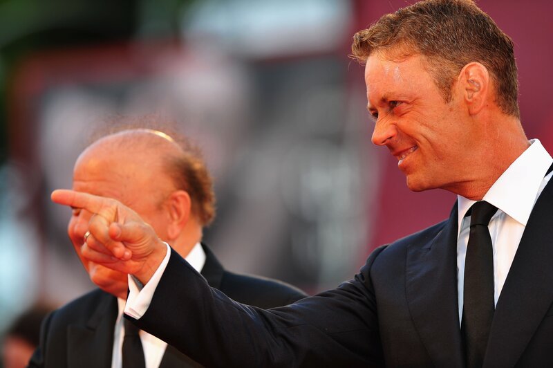 Man pointing at another man