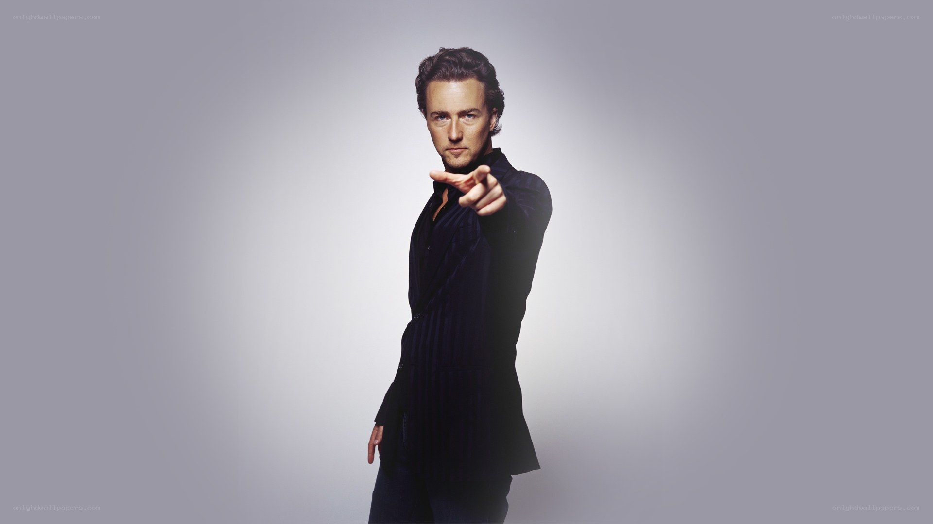 man pointing at camera
