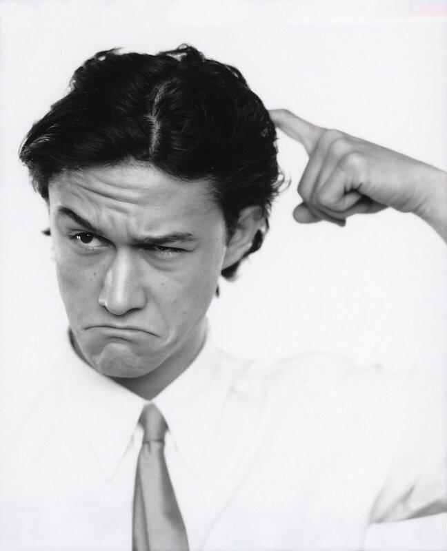 man pointing at head