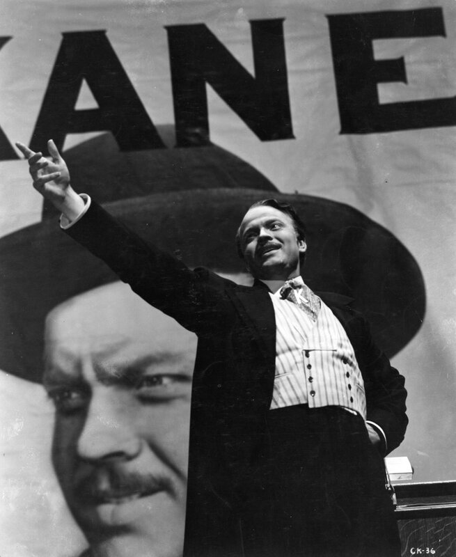 Man pointing at Kane poster