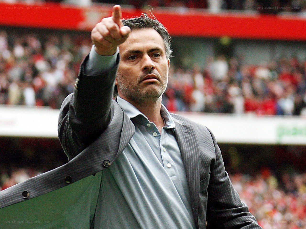man pointing at stadium