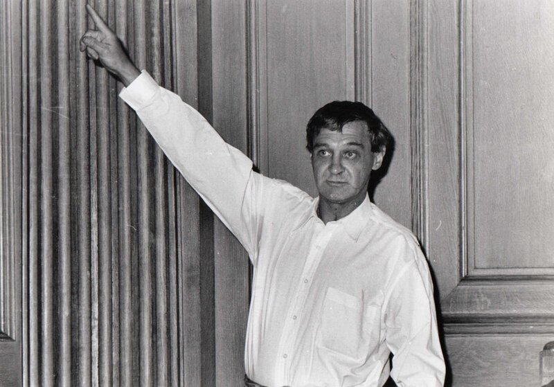 man pointing at wall