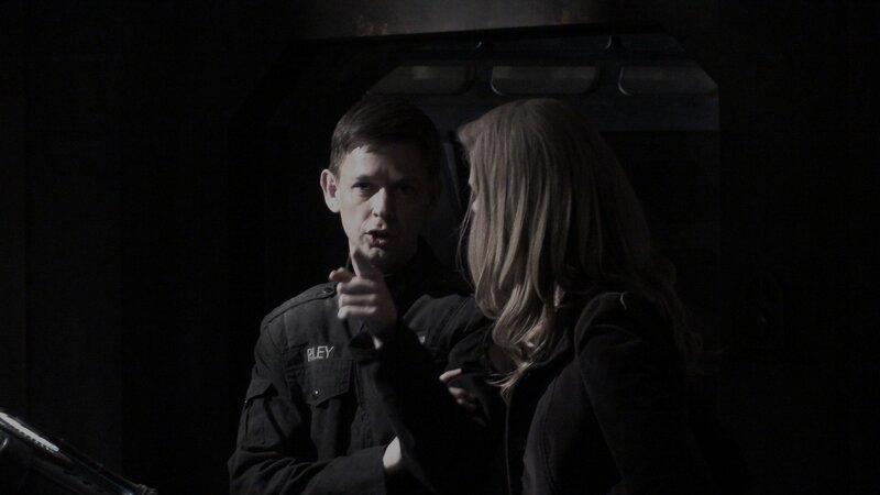 man pointing at woman