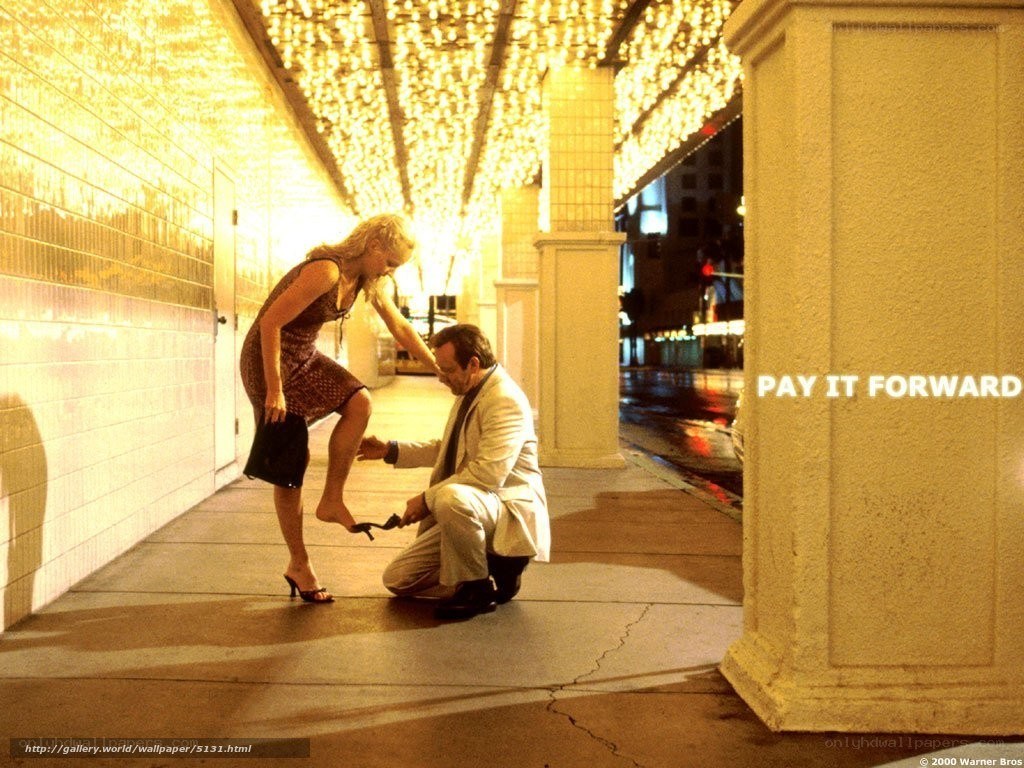 Man polishing woman's shoe