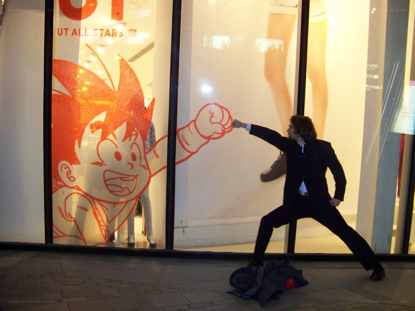 Man posing with anime character