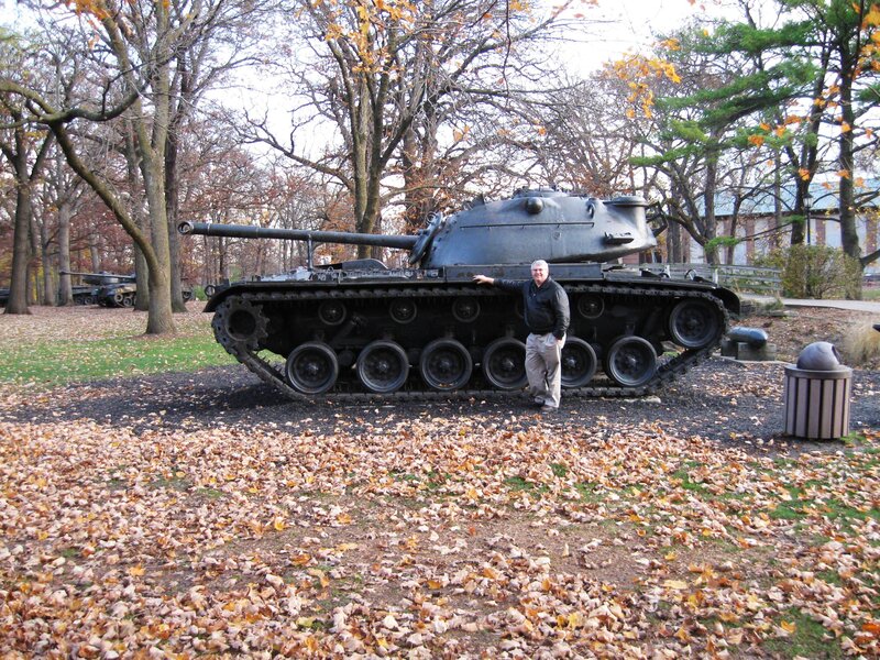 Man posing with tank in park