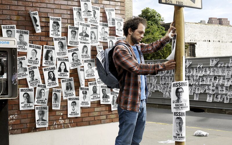 Man Posting Missing Posters