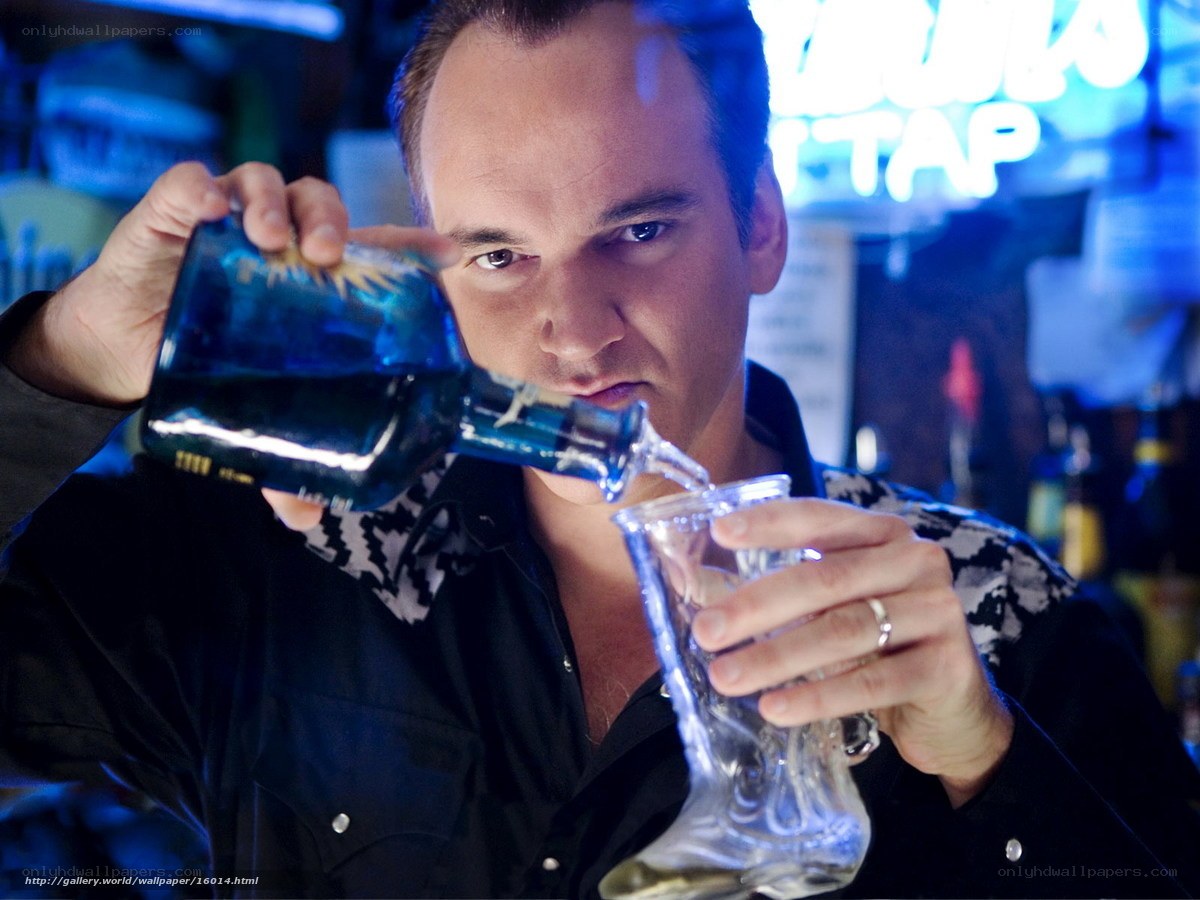 man pouring blue liquid