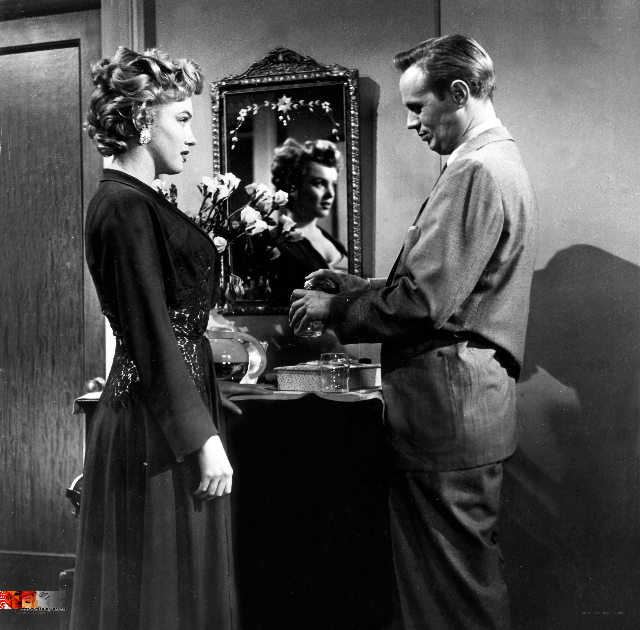 Man pouring drink for woman
