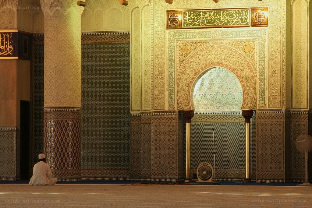 Man praying in a mosque