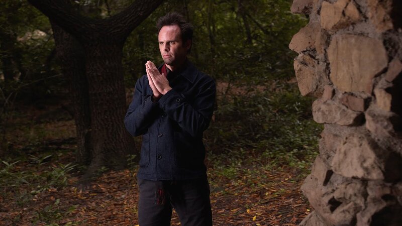man praying in forest