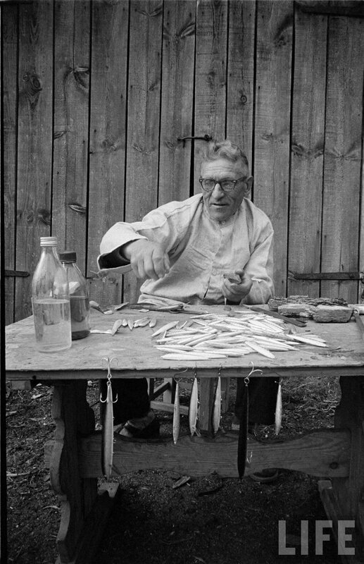 man preparing fish bait