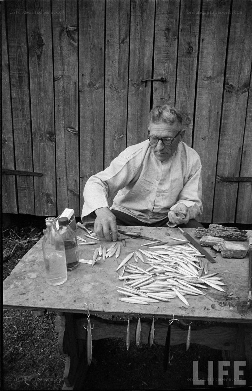 man preparing fishing bait