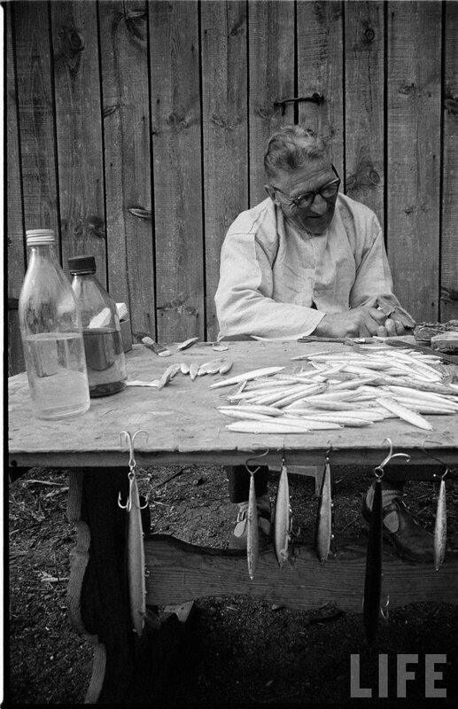 man preparing fishing lures