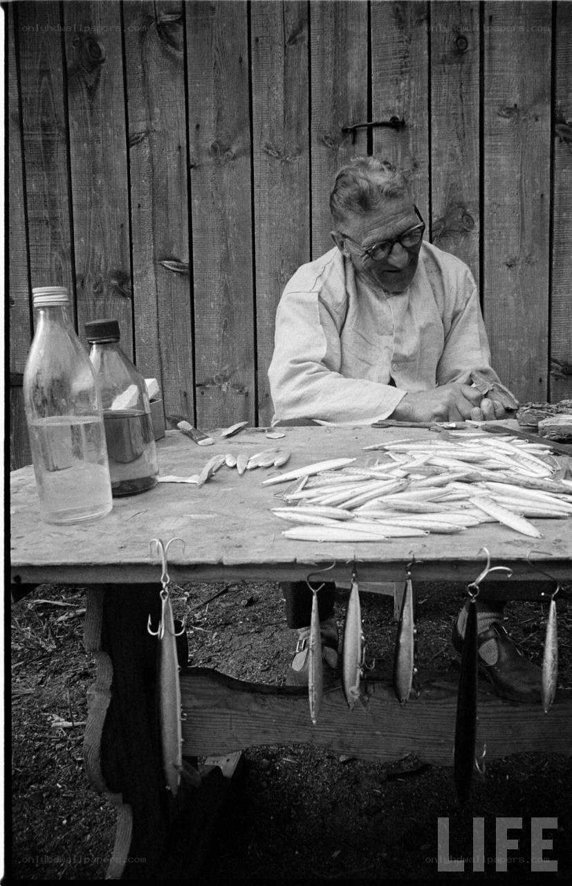 man preparing fishing lures