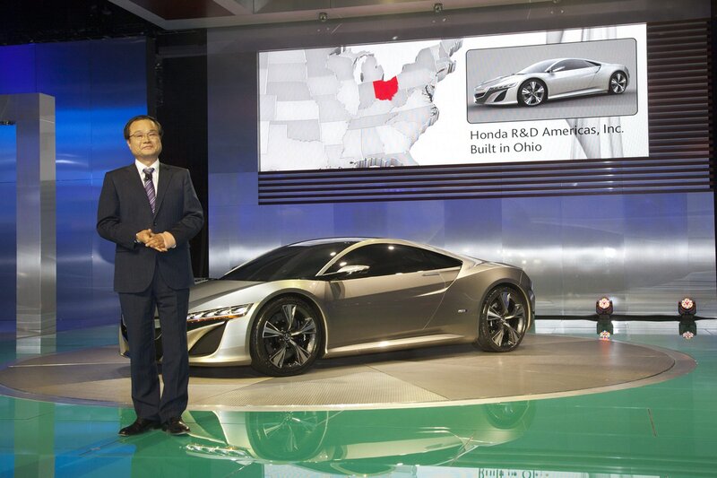 Man Presenting Car — Silver