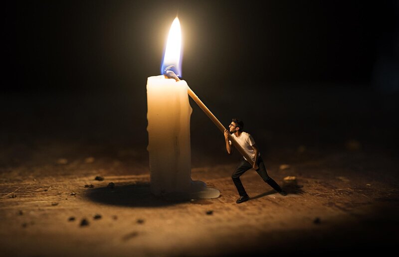 Man Pushing Candle