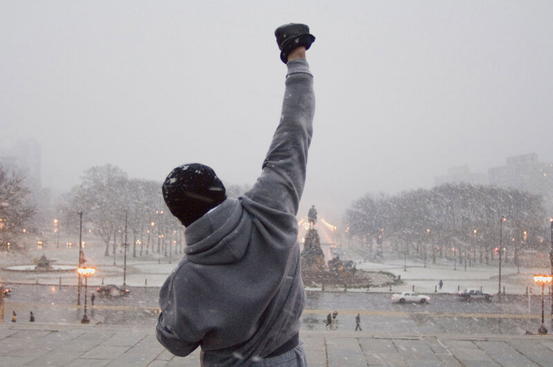 Man raising fist in snow